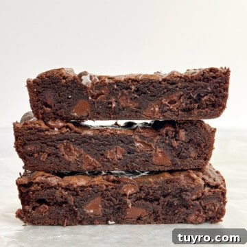 small batch brownies stacked on top of each other.
